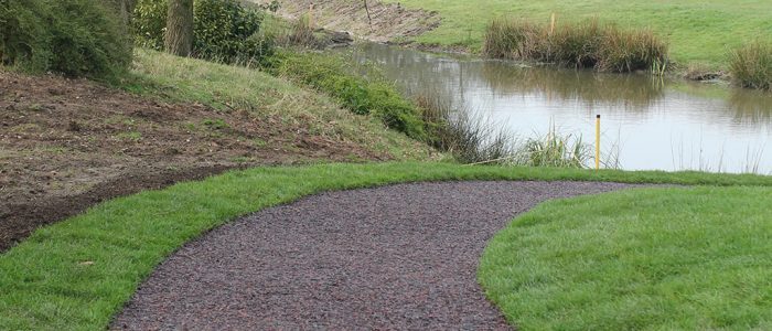 JungleMulch safety surfacing installation at golf course pathway