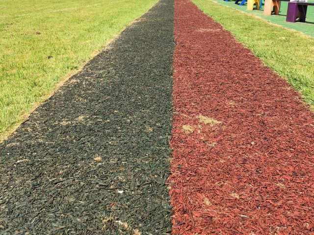 Boothwood Primary Red and Black Rubber Mulch Running Track Installation