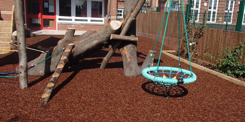 Original JungleMulch flooring to a bucket swing in a school play area