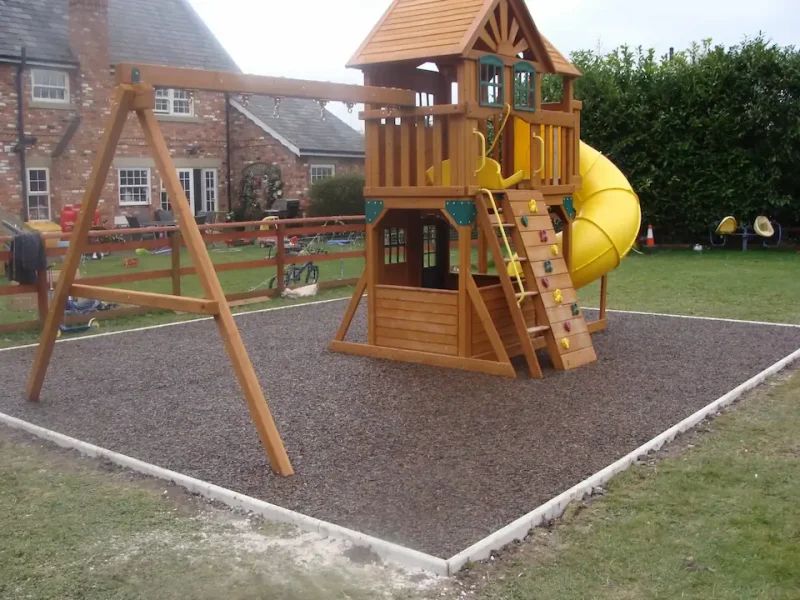 Private installation of Original Junglemulch underneath multiplay equipment in a garden