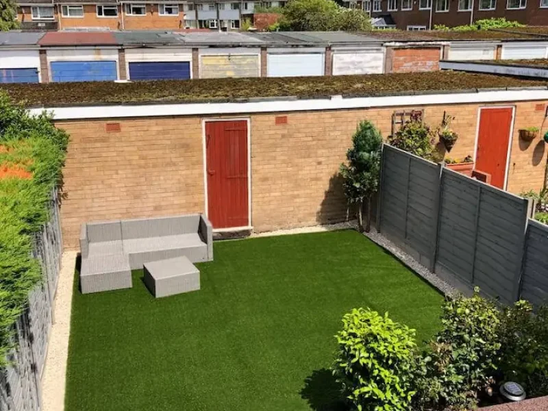 LushLawn modern garden area with garden furniture in its corner