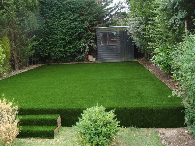 LushLawn artificial grass in garden with covered steps and stylish vertical section