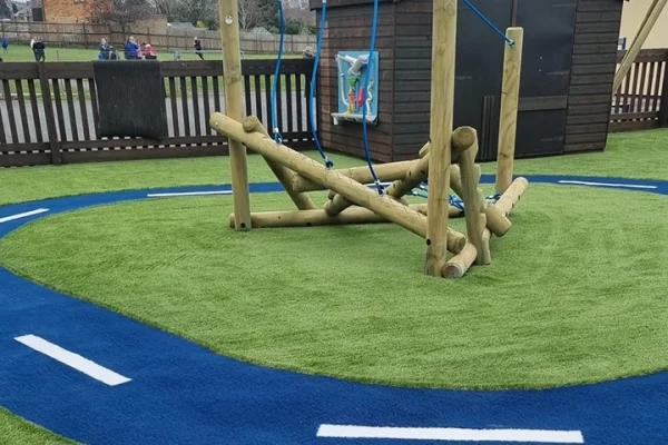 Grass carpet with race track in nursery playground