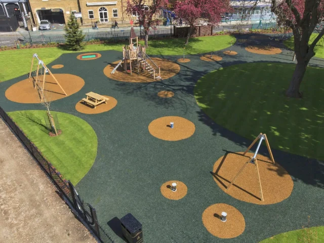 Large playground with PlaySmart wet pour and rubber mulch surfacing