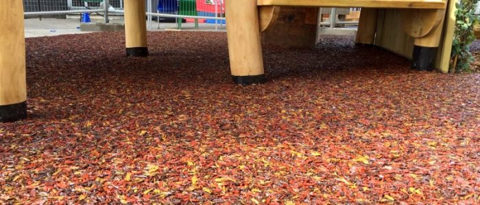 PlaySmart’s Jungle Mulch bonded rubber mulch outdoor play surfacing solution in Autumnal shades of red, yellow, orange and brown.