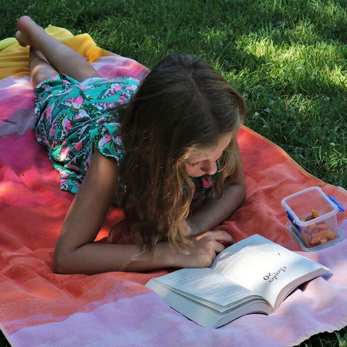 Child reading outdoors