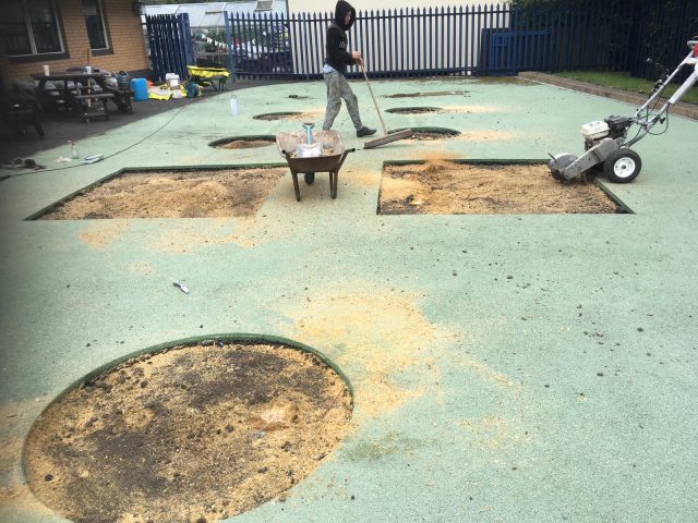 Step 2 - Wet Pour repairs first step with sand and aggregate rubber infill