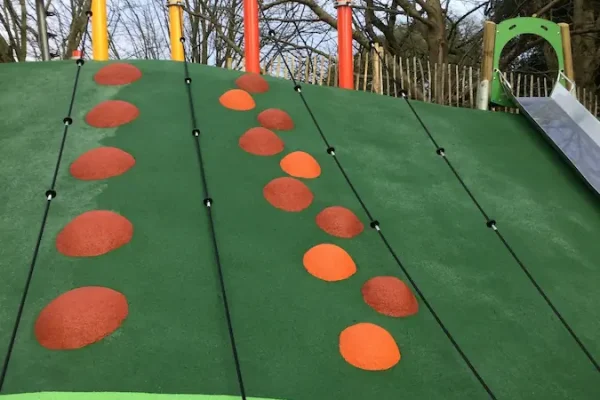 RubbaSmart up a slope with rope and stepping humps in a play area