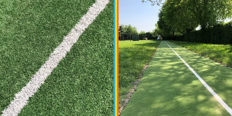 Green artificial grass with white lines