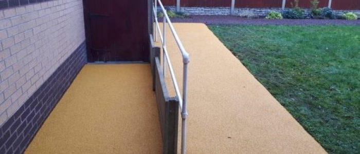 Yellow Rubber Mulch surface on accessibility ramp